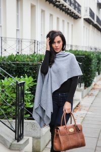 Front View of a lady in a winged grey cashmere wrap