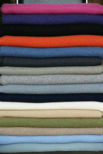 A pile of all our Classic Cashmere Wraps